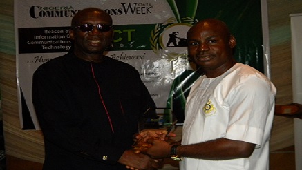 (L-r): Dr. Ernest Ndukwe, chairman, Openmedia Group presenting Information and Communication Technology Innovator of the Year award winner at the Beacon of ICT awards to Peter Asolo, managing director and chief executive officer, PetVini Global Concept, winners of the award.